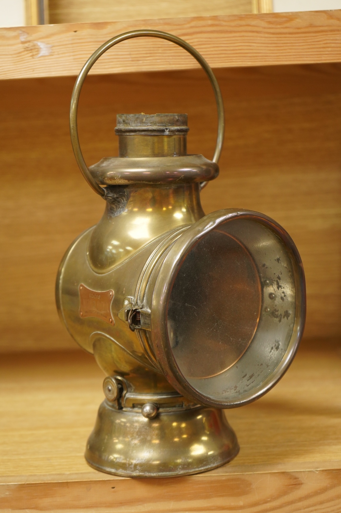 An early 20th century Lucas ‘King of the Road’ brass carriage lamp, 35cm high, together with five brass motorcycle lamps by Lucas, etc.